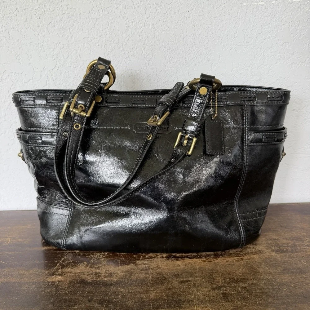 Coach Gallery Laced East West tote bag in black patent Leather Brass Hardware.